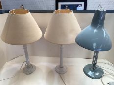 Pair of painted table lamps and plain cream shades, and an angle poised desk lamp, by Thousand and