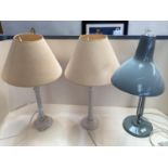Pair of painted table lamps and plain cream shades, and an angle poised desk lamp, by Thousand and