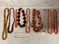 A collection of bead jewellery, to include a dogs tooth corat necklace, carnelian beads and three