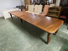 A mahogany square dining table, extending to an oblong metres table, with the extra leaves. Being