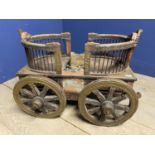 Antique rusticm twin perambulator, on 4 iron bound wheels