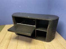 Modern side table with tambour front, opening to reveal shelves and pull out tray (as found)