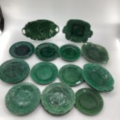 A quantity of green lustre Wedgwood and other plates and dishes