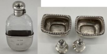 A sterling silver and cut glass hip flask by Mappin & Webb Sheffield 1899; A pair of sterling silver