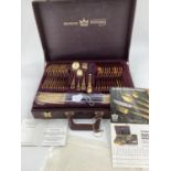 A gilt metal cutlery service, 12 person, by Bestecke Solingen, in fitted leather briefcase (unused)