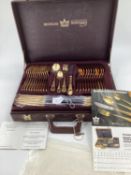 A gilt metal cutlery service, 12 person, by Bestecke Solingen, in fitted leather briefcase (unused)