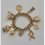 9ct gold curb link charm bracelet set throughout with 9ct gold and 2 unmarked yellow metal charms,