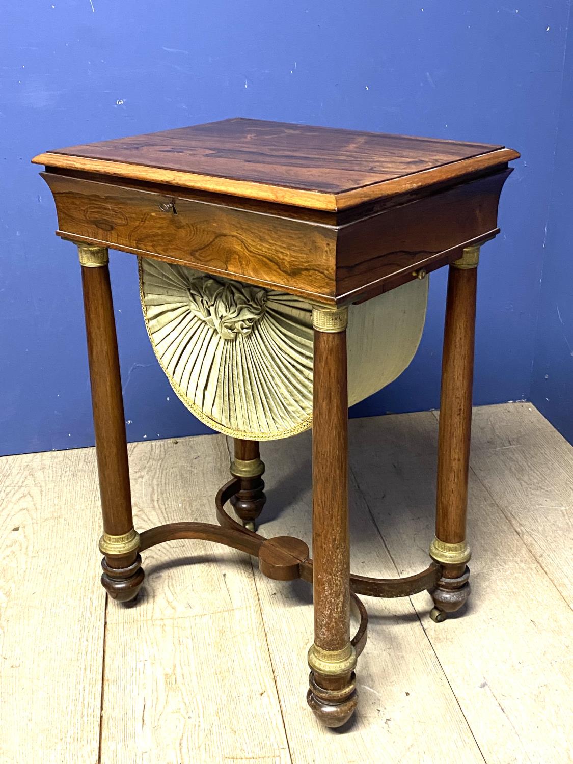 A Regency rosewood work table with rising lid