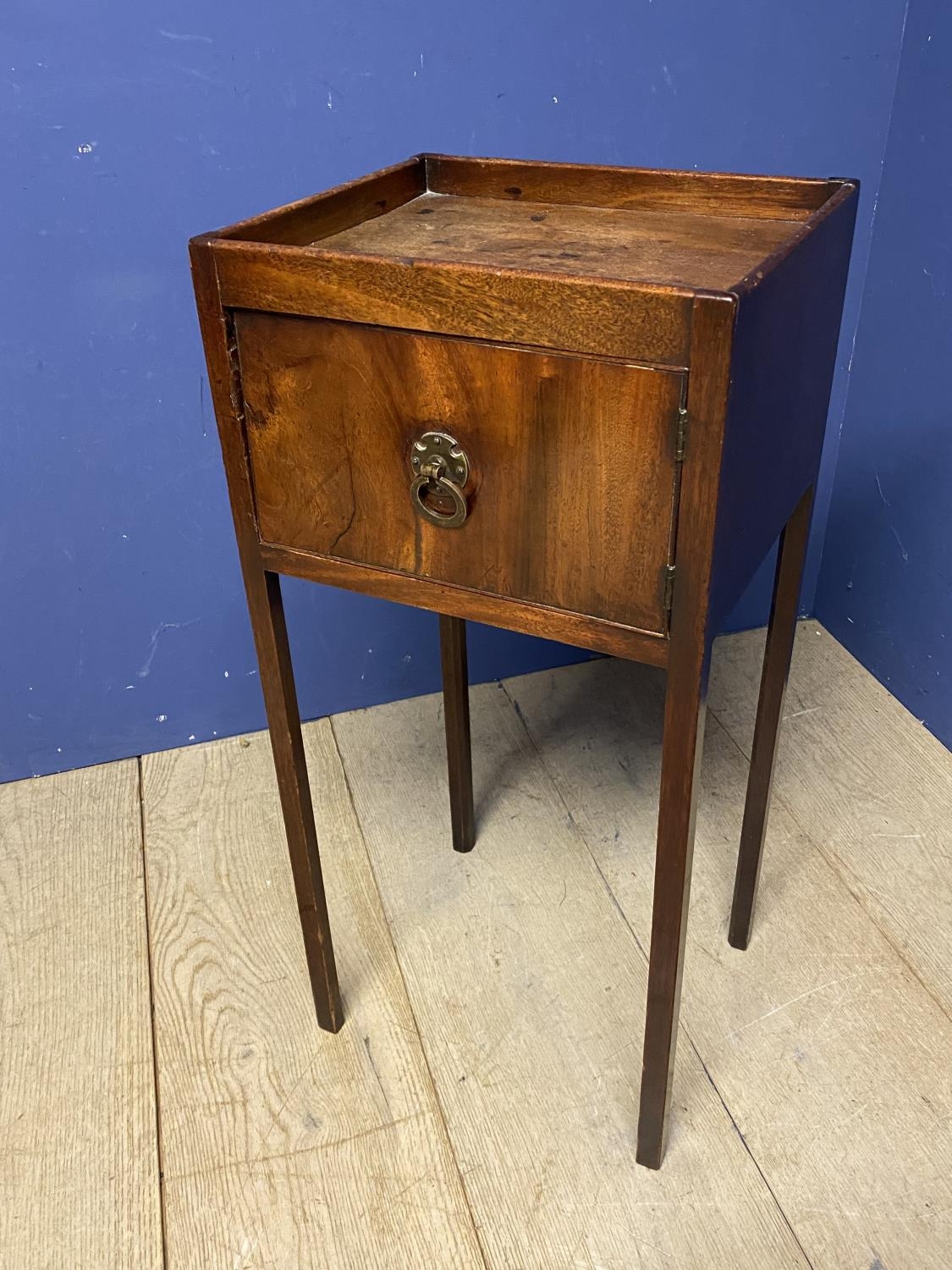 A small mahogany side table, tapered legs, cupboard door to front 36 x 77Hcm