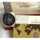 Omega Speedmaster Professional, manual wind chronograph wristwatch, the black dial with three