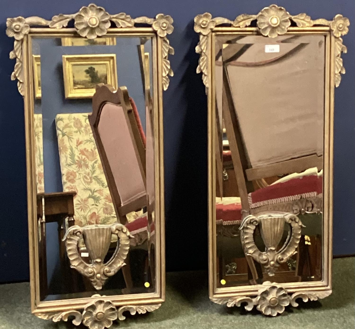 Pair of rectangular gilt gesso wall mirrors with cup and swag decoration