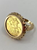 George V gold sovereign ring in a 9ct gold mount 14.25g size V approx