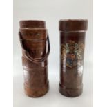 TWO WW1 leather artillery shell carriers, one with military crest, one with carrying handle, both as