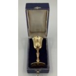 An 18ct gold, Irish, Decorative Goblet, with engraved stem and circular foot, 11cm(h), 287g, in