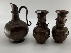 A pair of bronze effect baluster vases, with cast dragon decoration, 25cm high, and a bronze ewer