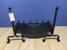 A new black fire grate and two companion stands