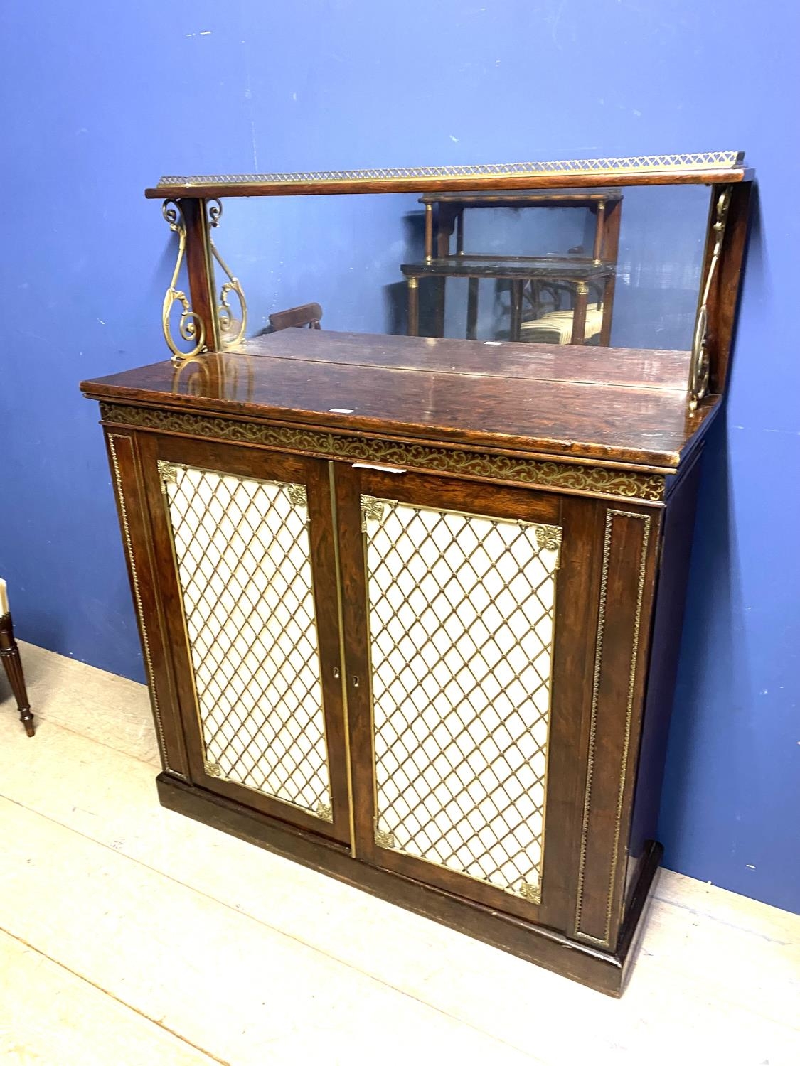 Good Regency brass inlaid rosewood chiffonier with mirrored back below brass galleried shelf above a