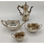 A sterling silver 3 piece tea set of half reeded design by JW Story and W Elliot, Lon