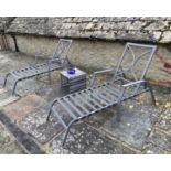 GARDEN FURNITURE: Pair of metal steamer type garden reclining chairs, with 2 grey cushions