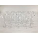 William Yeoward 12 champagne glasses, (and 4 further glasses with chip);