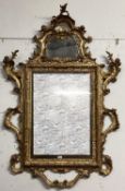 A George III giltwood carved mirror, pierced scrolling top with mirror cartouche, rectangular