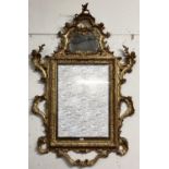 A George III giltwood carved mirror, pierced scrolling top with mirror cartouche, rectangular