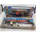 Two boxed trains, LMS Main Freight, and Hornby Railways Midlander Goods, see images