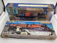 Two boxed trains, LMS Main Freight, and Hornby Railways Midlander Goods, see images