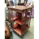 Edwardian inlaid mahogany square revolving bookcase, with Arts and Crafts style supports, 51cmsq x