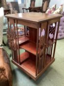 Edwardian inlaid mahogany square revolving bookcase, with Arts and Crafts style supports, 51cmsq x