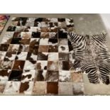 Two rugs: zebra 130x198cm slightly worn, not backed cowhide patchwork rug 202cm x 163cm worn in