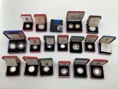 A collection of silver and white metal commemorative coins. To include silver proof examples.