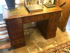 A small mahogany twin pedestal nine drawer desk with green tooled leather top, 105cmL x 69cmH,