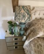 Four pieces of mirrored furniture: pair of 3 drawer mirrored bedside tables, a small narrow 4 drawer
