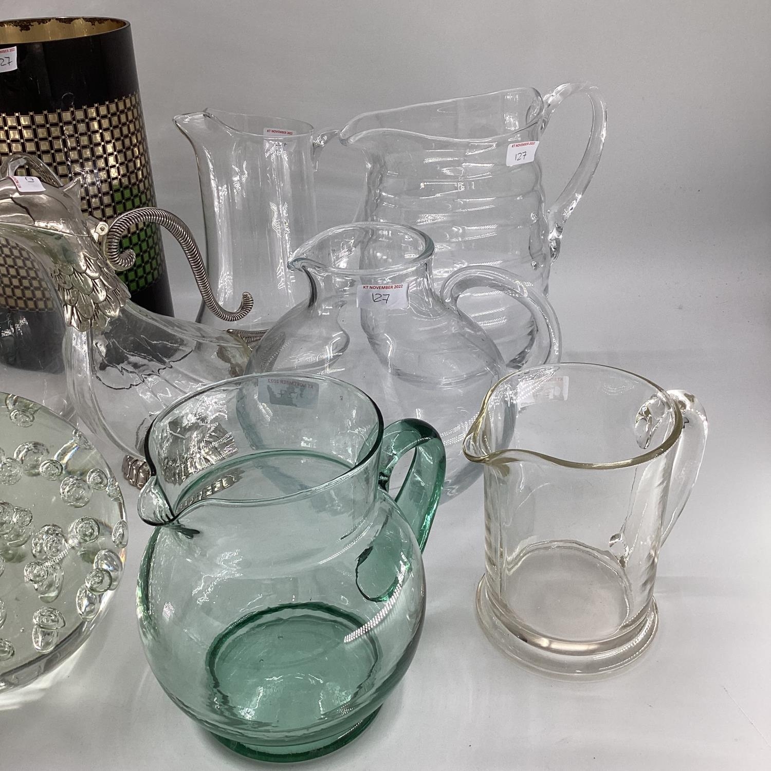 A quantity of glass jugs, including a decorative glass jug with silver plated head and tail styled - Image 3 of 10