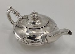 A Georgian silver coffee pot of squat bulbous form, by Rebecca Emes and Edward Barnard I London,