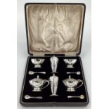 A sterling silver condiment set in the Art Deco style, in fitted box, by Edward Barnard and Son Ltd,