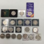 A collection of white metal commerative coins