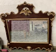 A Georgian style gilt and mahogany overmantel mirror, spread eagle crest over rectangular plate,