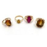 A collection of gold gem set and paste rings, two 18ct, one 15ct, one 9ct, total weight 19.5g