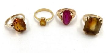 A collection of gold gem set and paste rings, two 18ct, one 15ct, one 9ct, total weight 19.5g