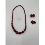 A string of cherry amber graduated beads with additional beads, 106g, 70cm
