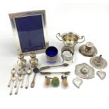 A collection of sterling silver white metal items to include tea strainer, picture frame, ETC