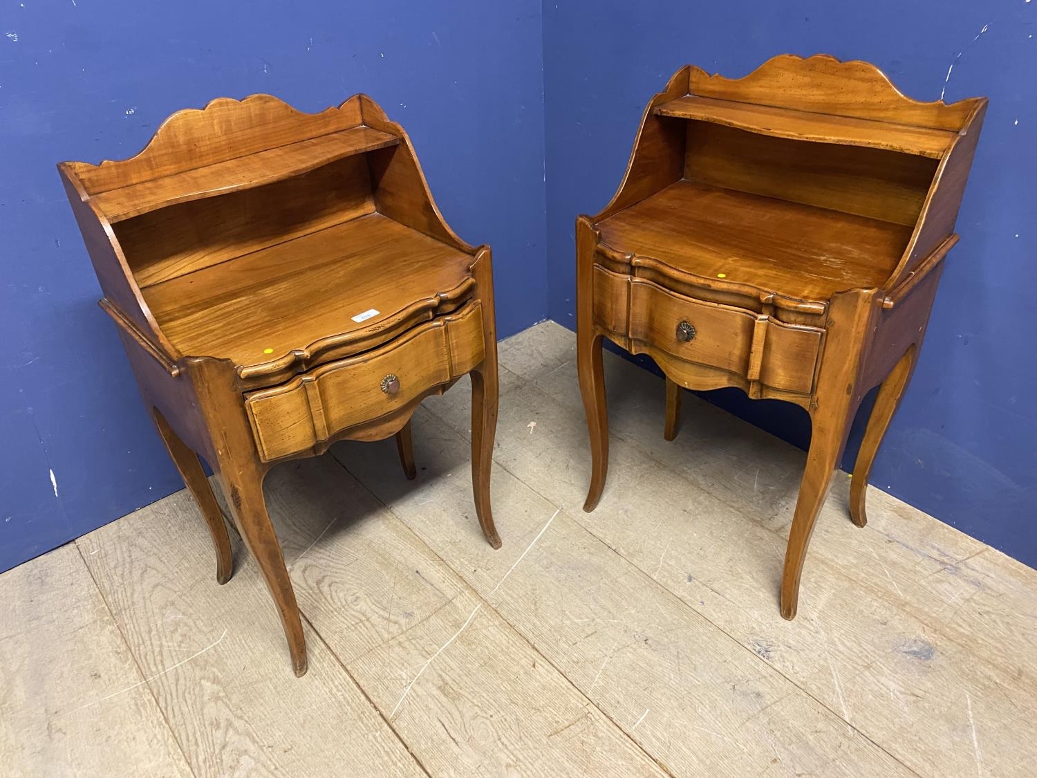 Pair of modern serpentine fronted bedside tables with single drawer and tiered shelf