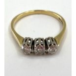 An 18ct gold and diamond three stone ring, 2.69g, size O