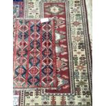 Two Antique rugs, one of red ground with geometric design, 98 x 170; 57 x 100cm