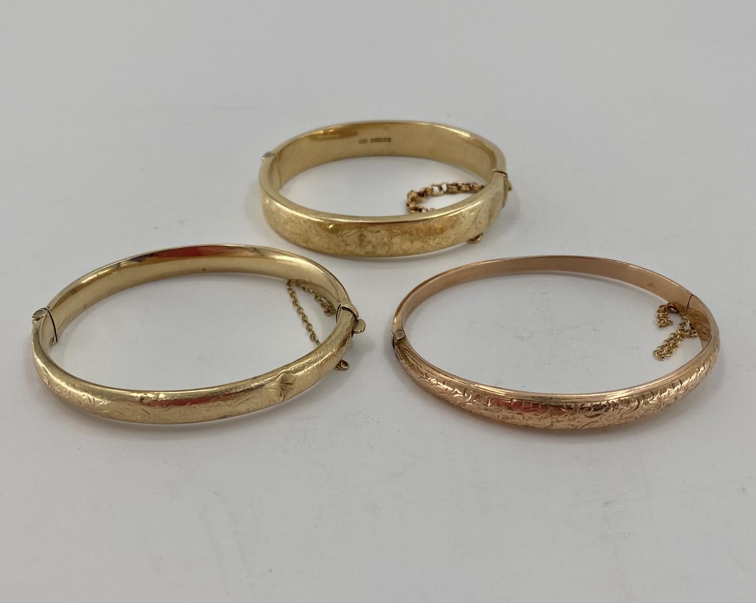 Three 9ct gold bangle bracelets 34.8g