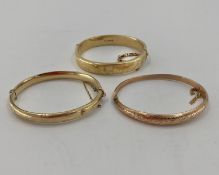 Three 9ct gold bangle bracelets 34.8g