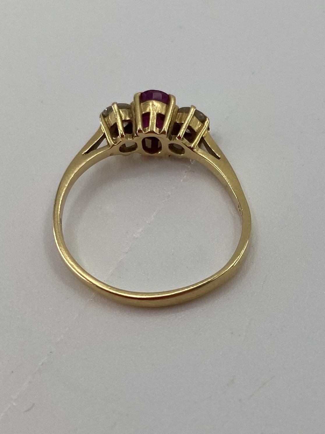 An 18ct gold ruby and diamond ring single oval free cut ruby with brilliant cut diamond accents , - Image 3 of 6