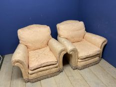 Pair of good quality deep seated traditional arm chairs with loose cushions in soft peach upholstery